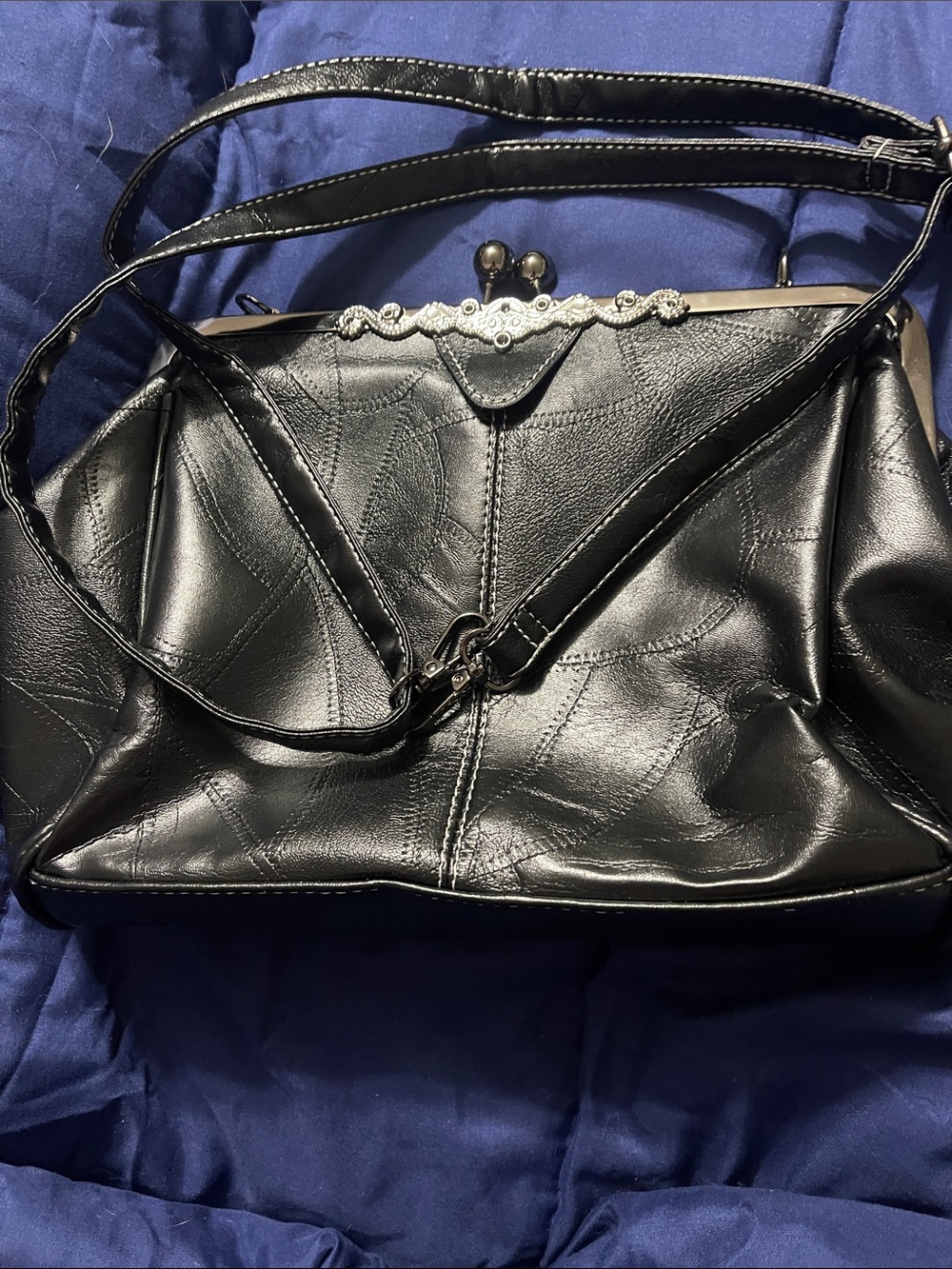 Structured Black Shoulder Bag with Decorative Frame
